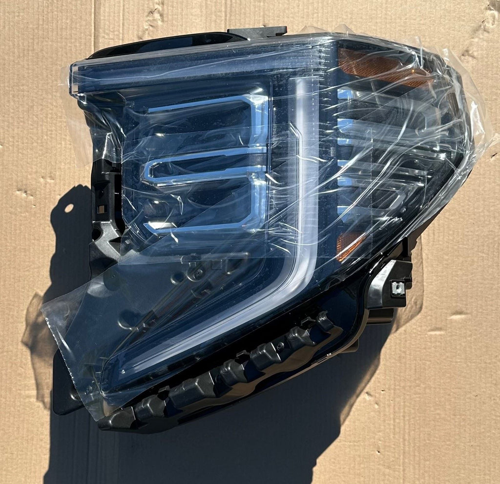 GM Front Headlamp Assembly 85064856 Driver Side - 1 Broken Tab - Nos